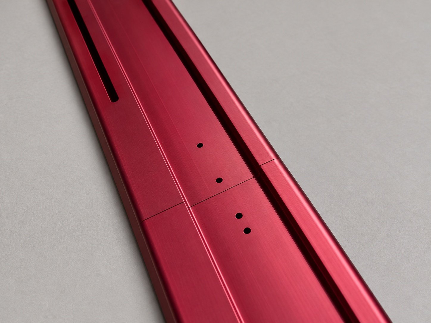 Red finished aluminum component with joint detail